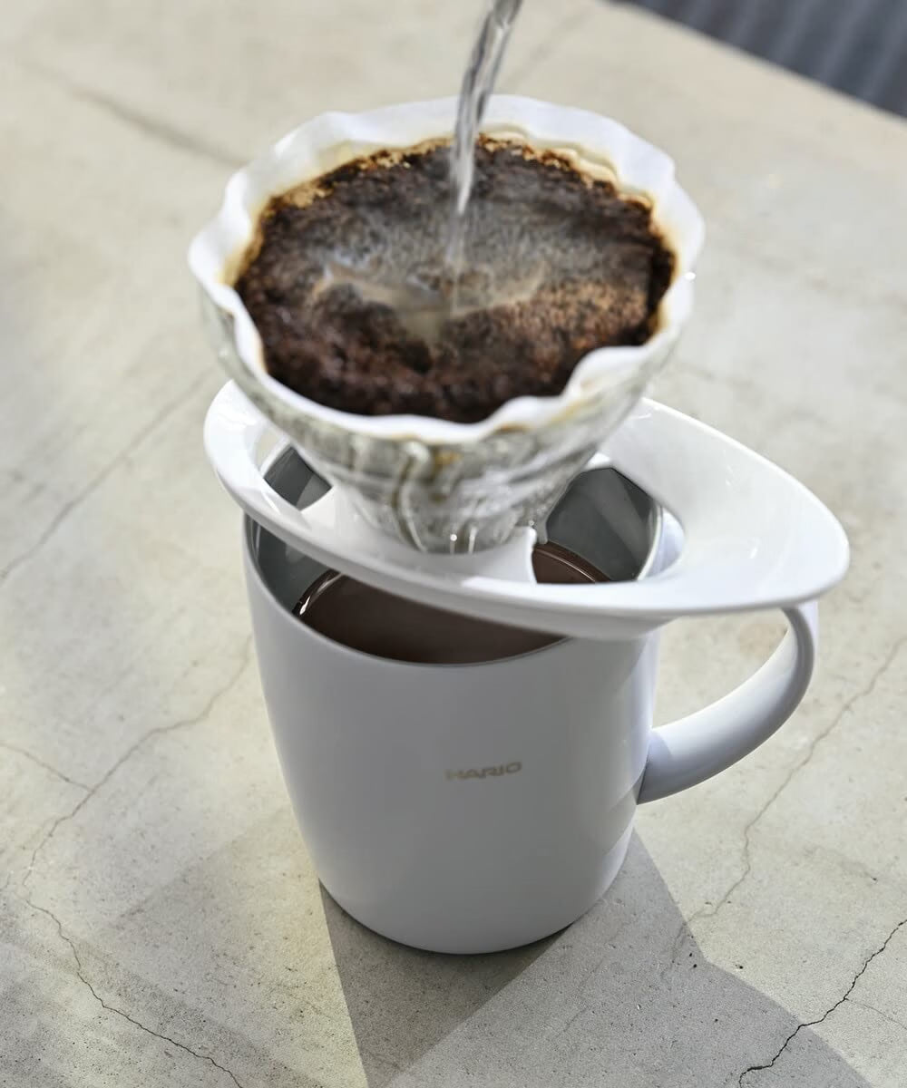 HARIO V60 01 white heatproof glass dripper, 1–2 cups: The V60 01 dripper is brewing above a coffee cup; the cup is a scene prop.