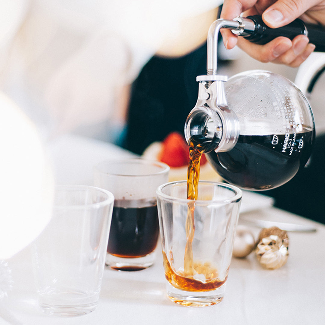 Pouring brewed coffee from HARIO Technica TCAR-3