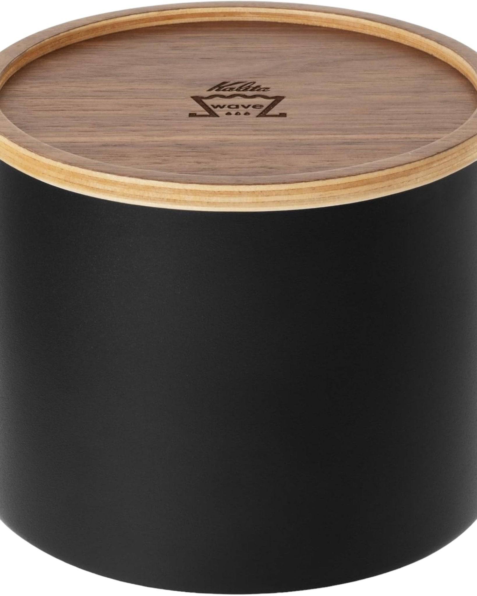 Kalita 155/185 Roshi filter paper container with black cylindrical body and wooden lid featuring Kalita Wave logo, designed for storing and protecting coffee filter papers from moisture and dust