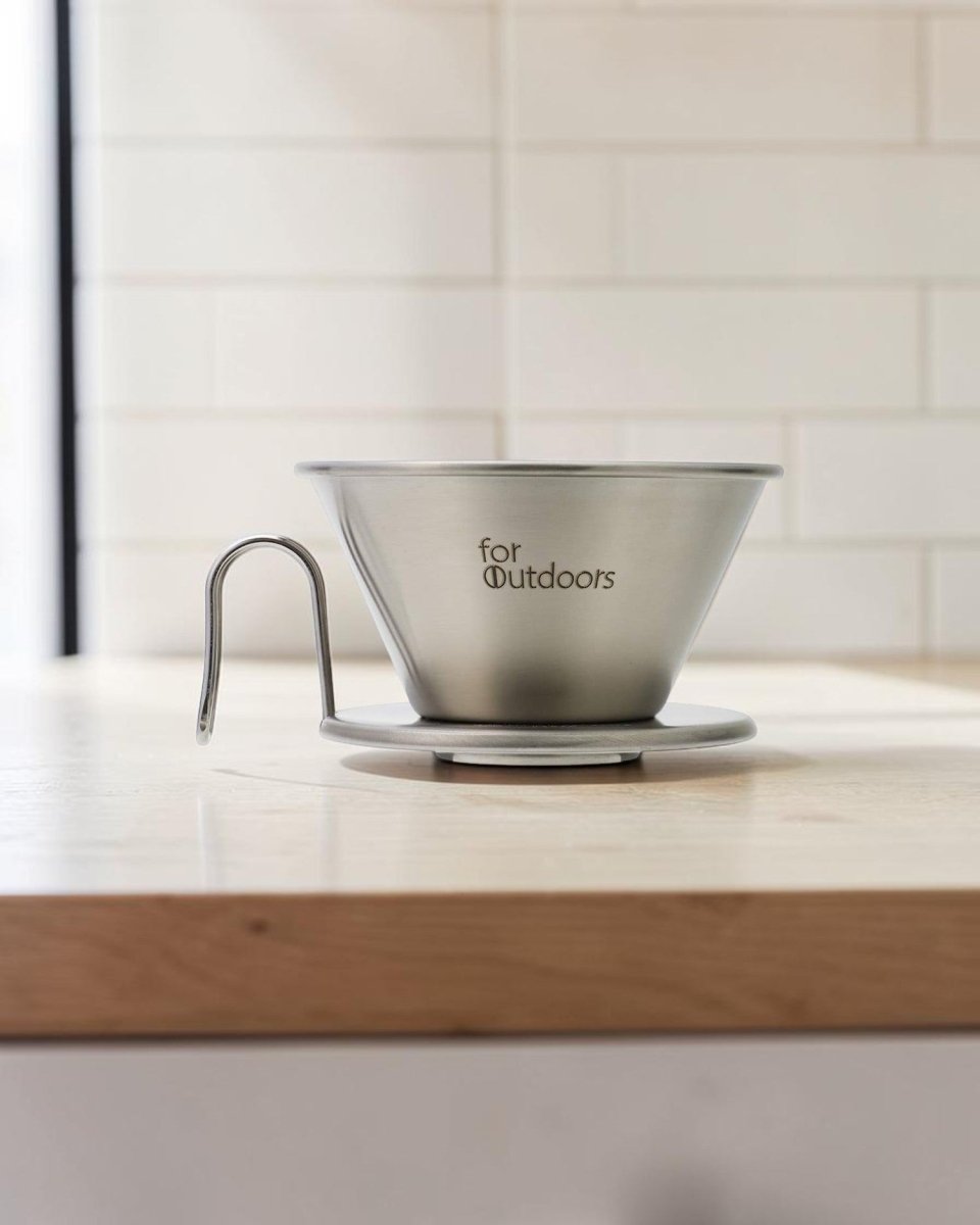 Kalita for Outdoors WDS-185K stainless steel Wave dripper on a wooden kitchen coffee countertop