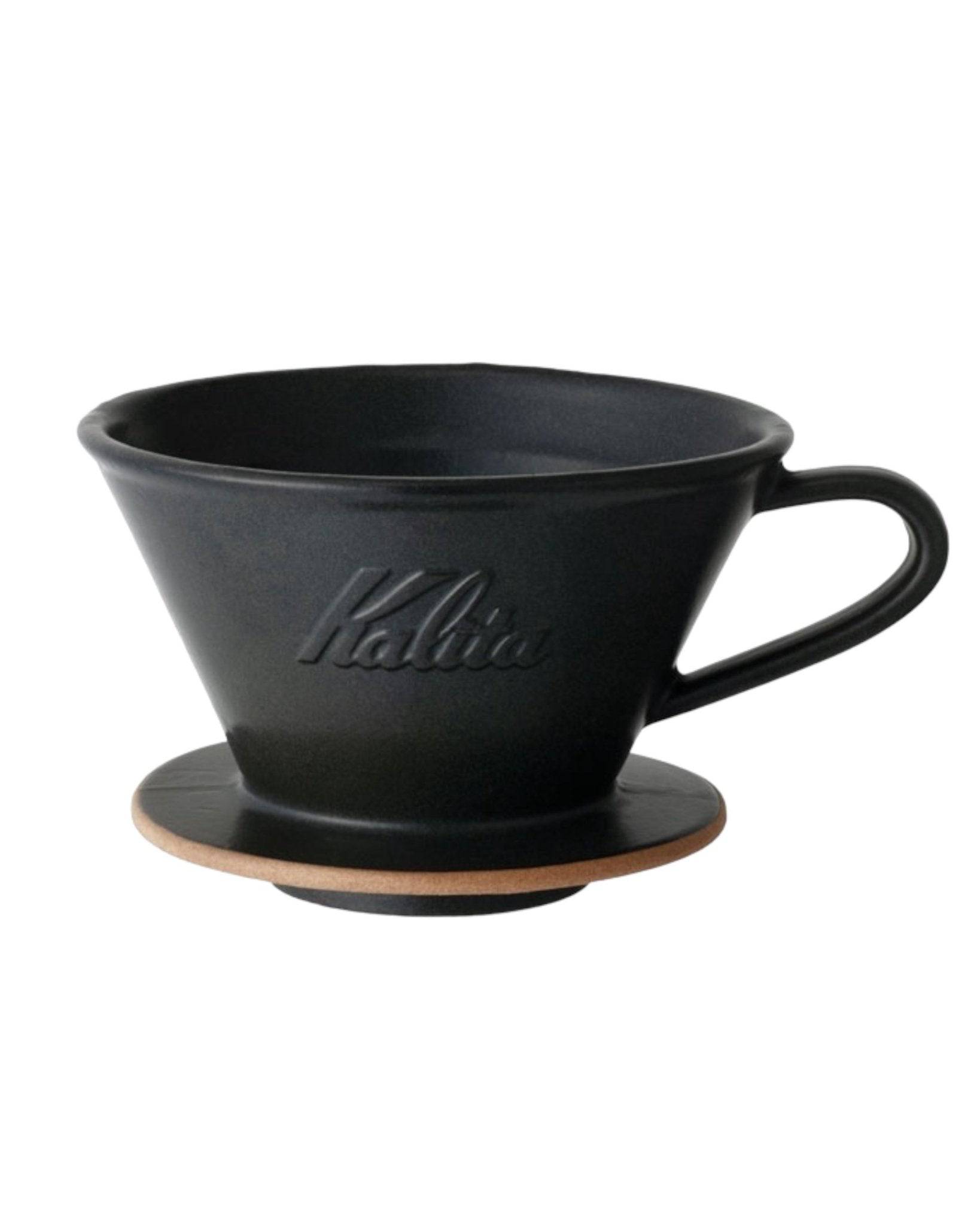 Kalita MI185 black ceramic pour-over coffee dripper with flat bottom and three-hole design, featuring embossed Kalita logo and wooden base for optimal coffee extraction
