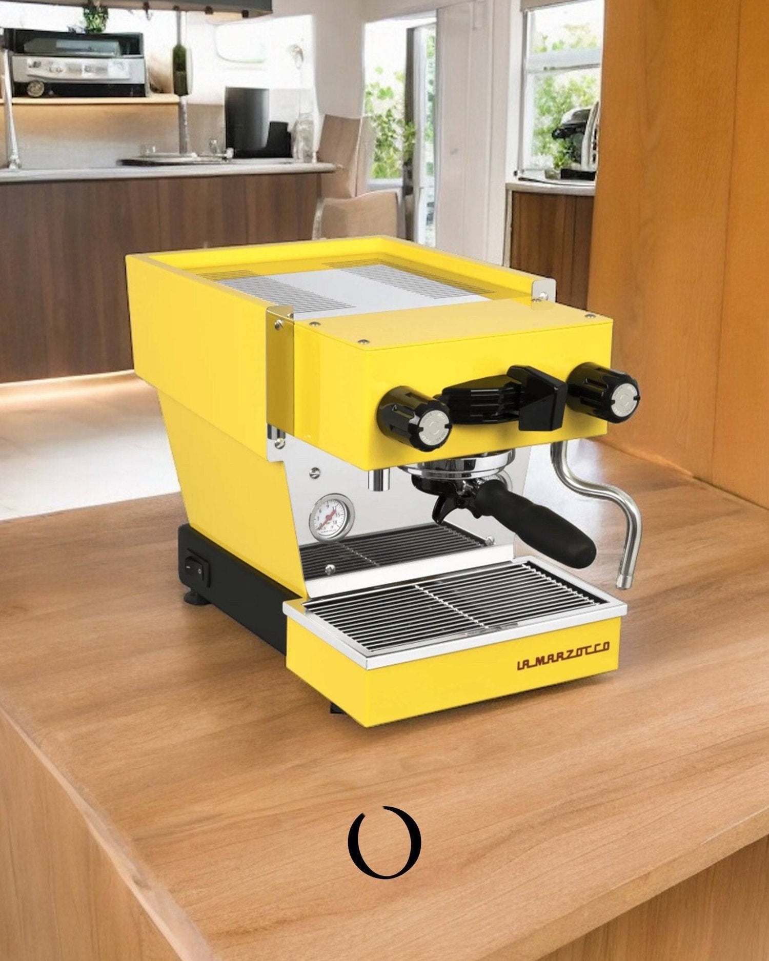 Bright yellow La Marzocco Linea Micra espresso machine on wooden countertop in modern kitchen, showcasing compact design and professional-grade features for home baristas.