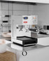 Lelit Anna PL41TEM espresso machine with PID temperature control on kitchen counter, featuring stainless steel design, pressure gauge, and digital display for precise brewing