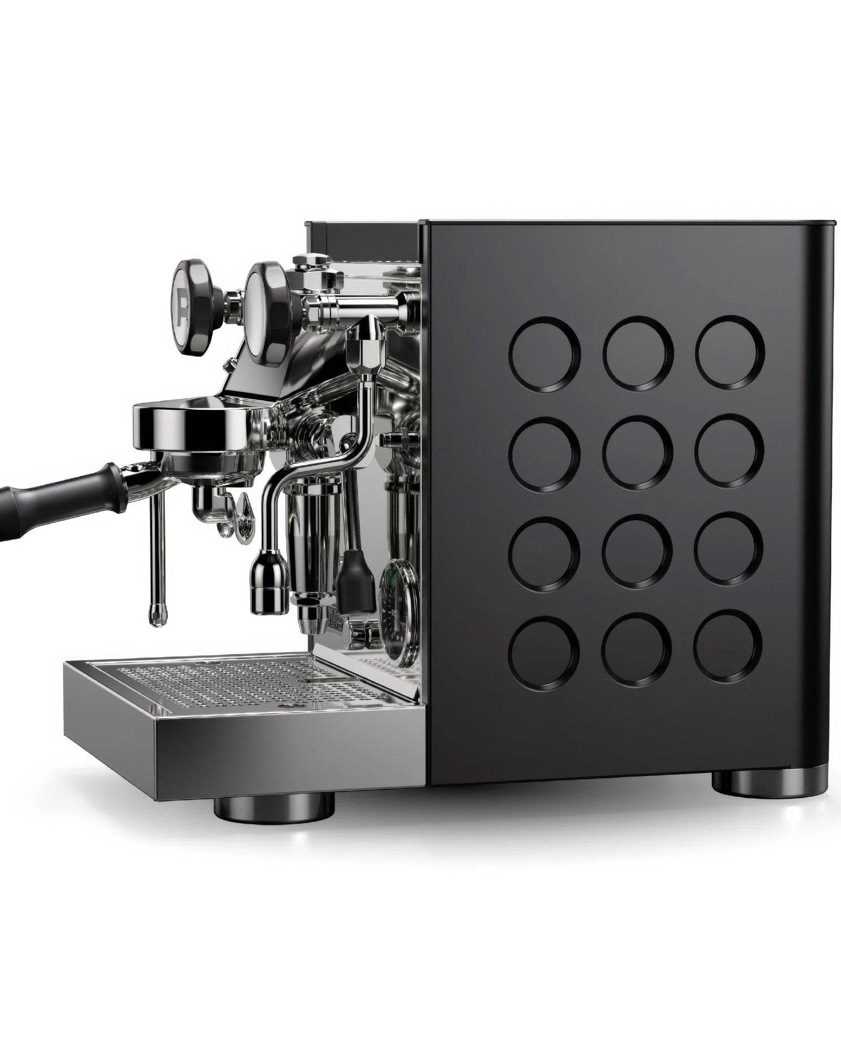 Sleek black Rocket Appartamento TCA espresso machine with circular design elements, showcasing portafilter, steam wand, and drip tray on stainless steel base