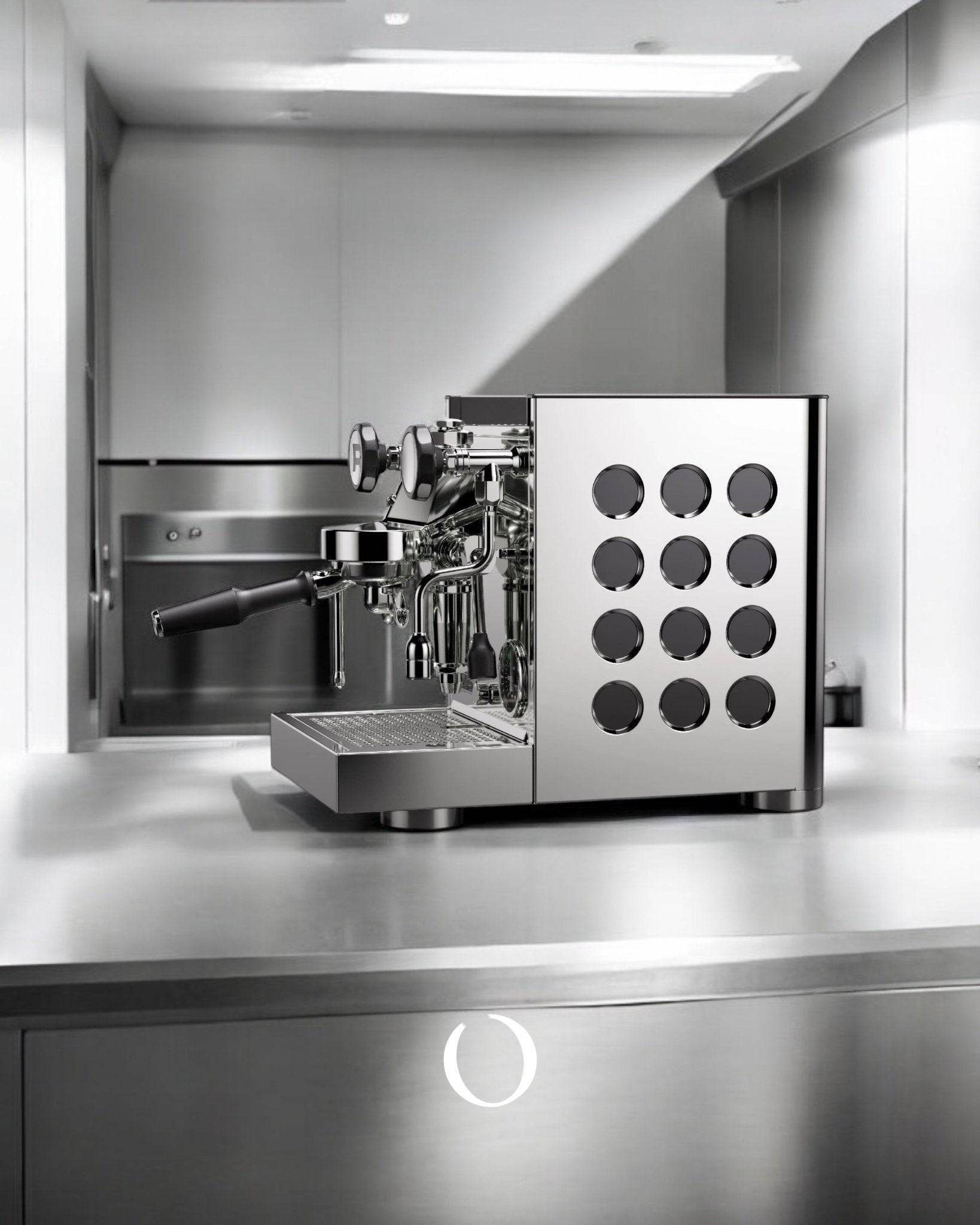 Sleek stainless steel espresso machine with circular design elements on countertop, showcasing modern minimalist aesthetic for Rocket Appartamento TCA semi-automatic espresso maker