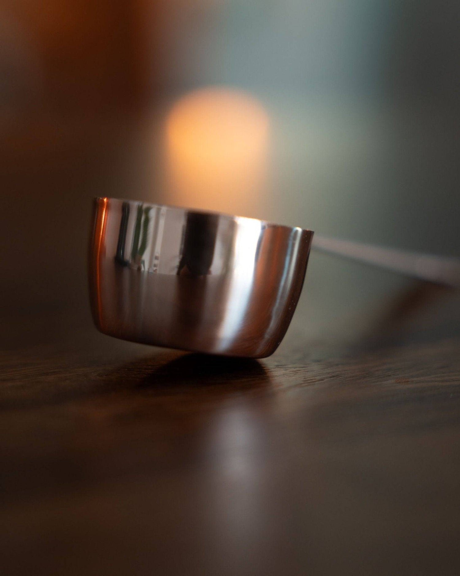 Kalita copper coffee scoop with laurel pattern, 10 grams capacity, elegantly designed for precise measuring, resting on wooden surface with soft background blur