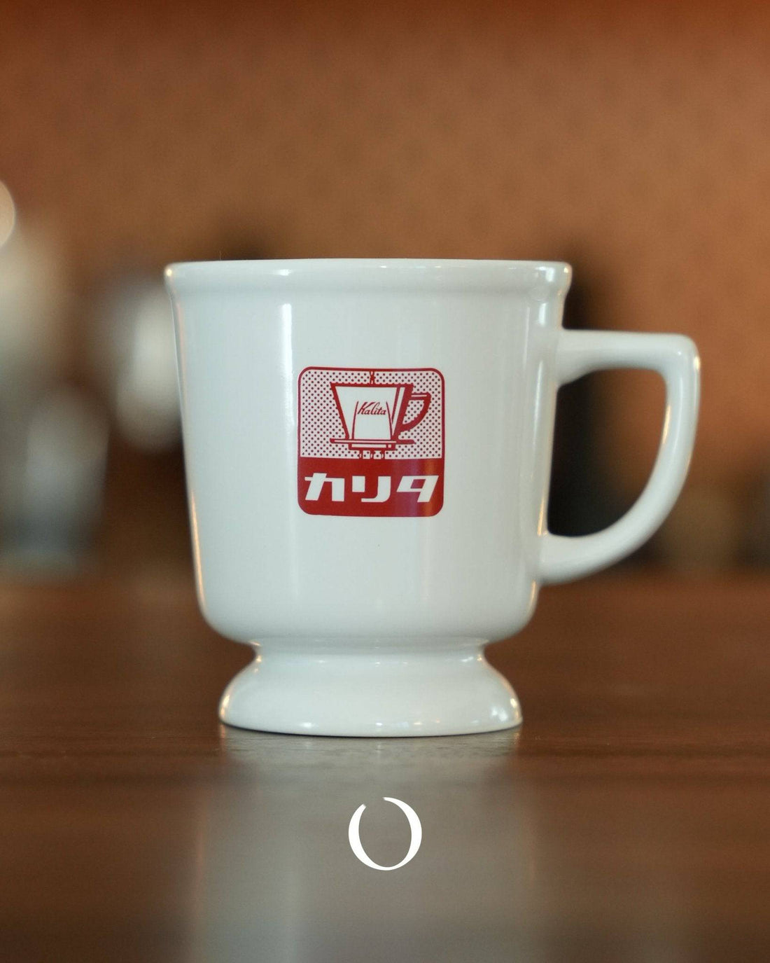 Vintage Kalita coffee mug in white ceramic with red retro logo, showcasing Showa era design on wooden surface, perfect for nostalgic coffee experience