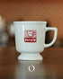 Vintage Kalita coffee mug in white ceramic with red retro logo, showcasing Showa era design on wooden surface, perfect for nostalgic coffee experience