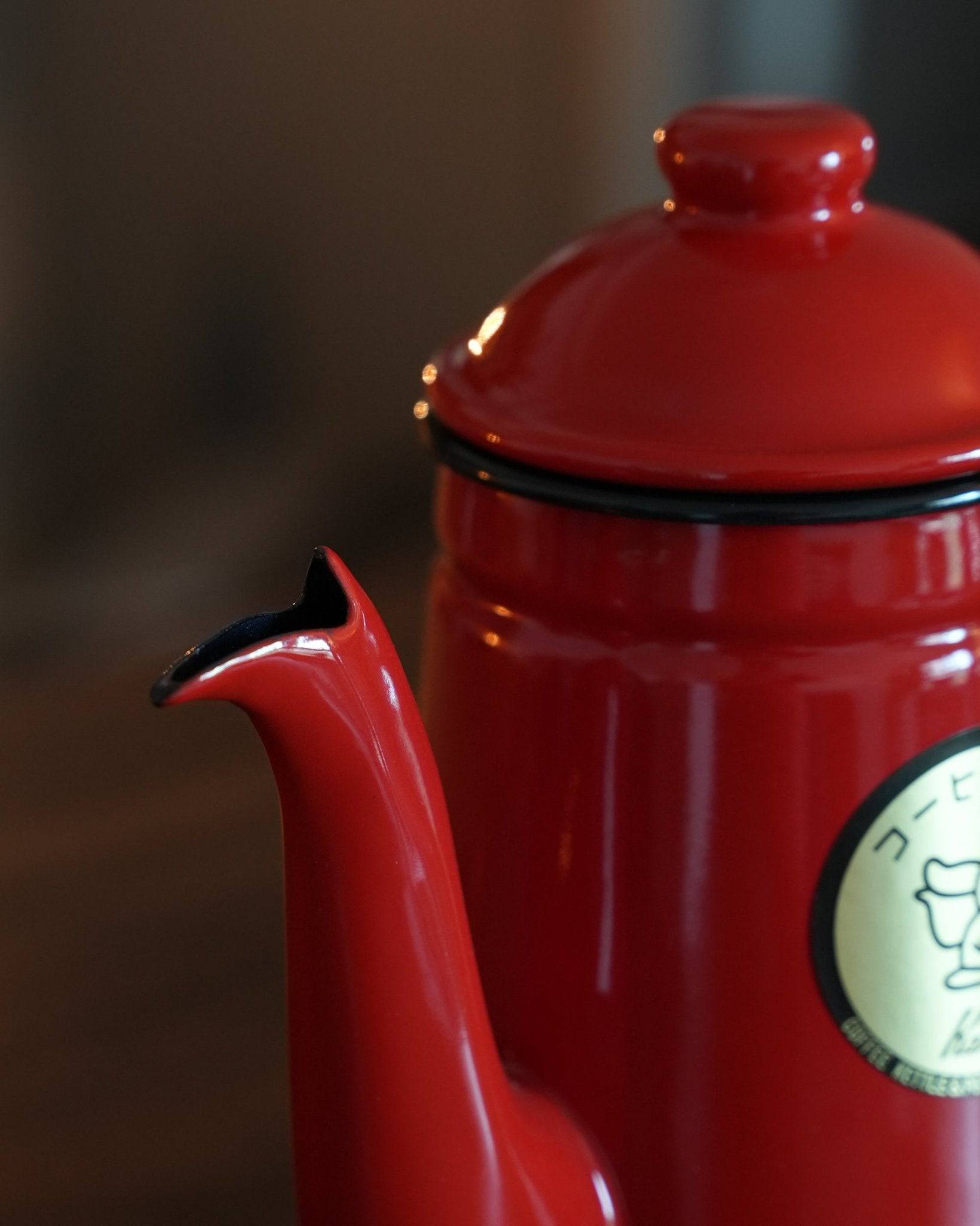 Kalita red enamel pour-over kettle with gooseneck spout, 1L capacity, featuring glossy finish and brand logo, ideal for precise coffee brewing