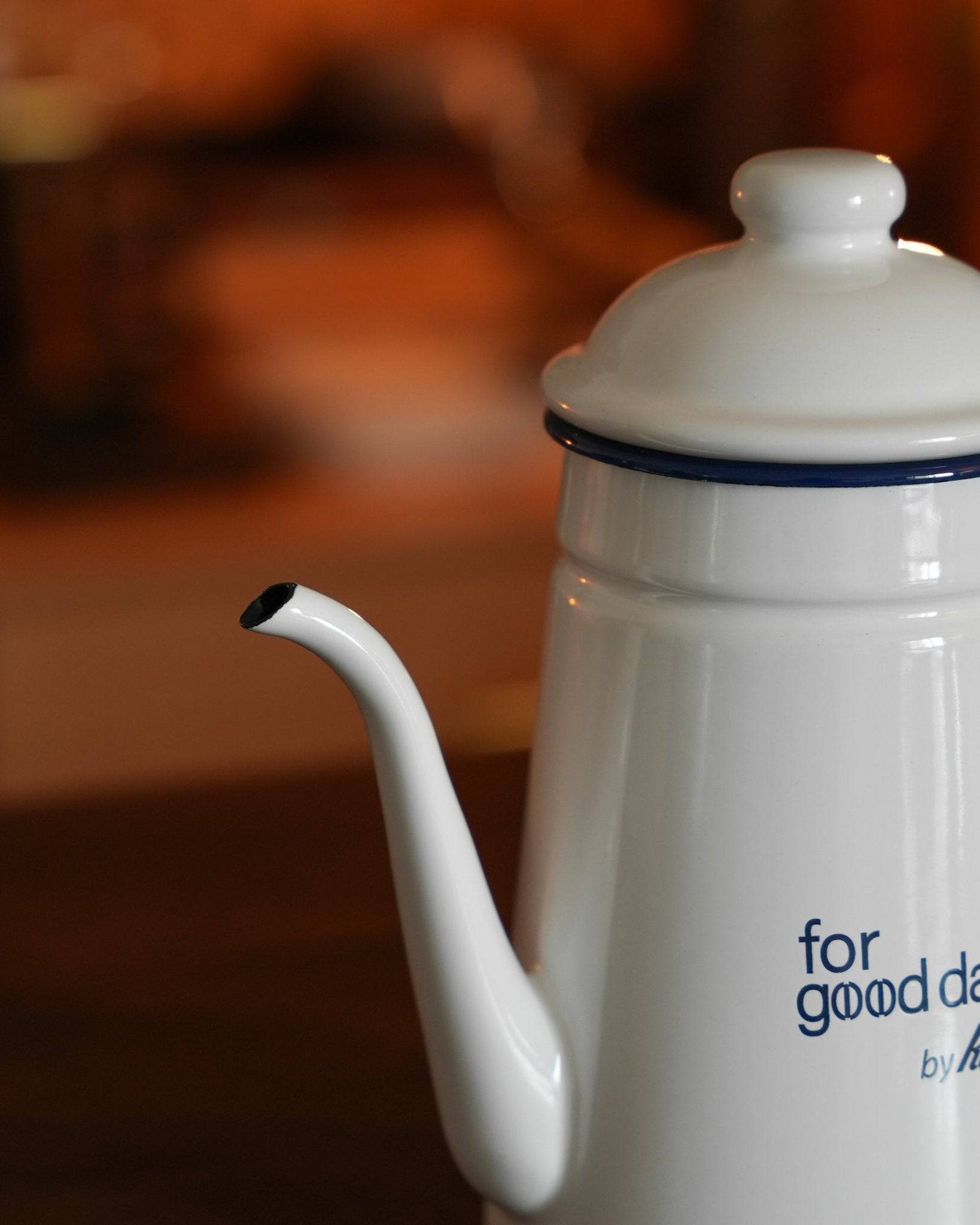 Kalita white enamel pour-over kettle, limited edition 1L, featuring "for good days" text, on warm wooden surface, perfect for precise coffee brewing