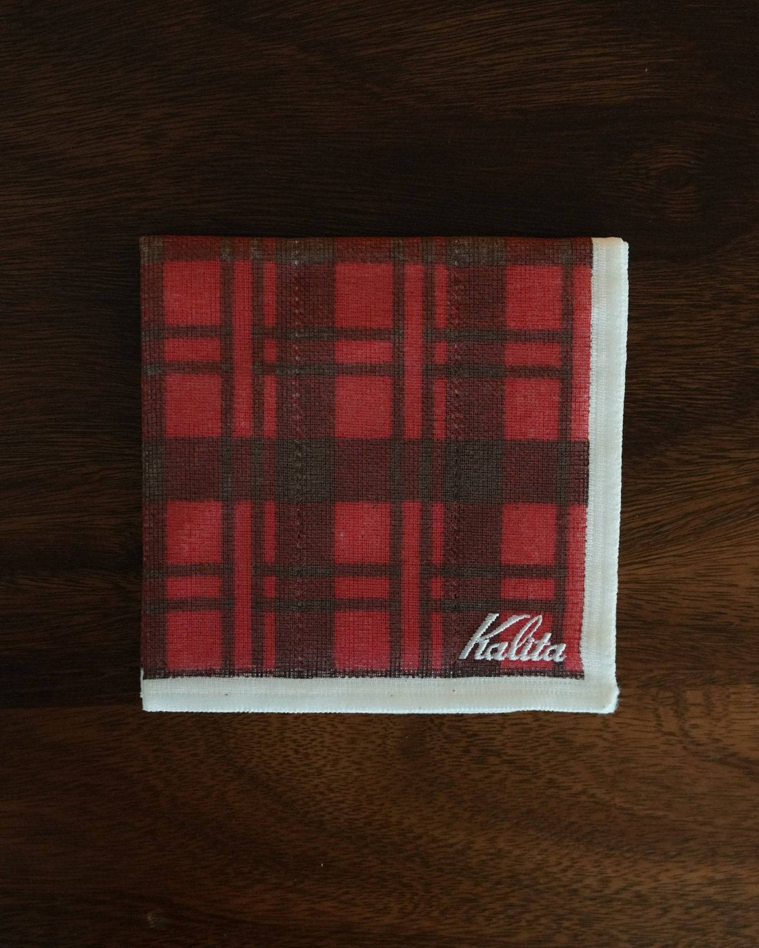 Kalita classic red plaid cloth for pour-over coffee, 30x30cm, 100% cotton, Japanese-made, stylish and functional, displayed on dark wooden surface
