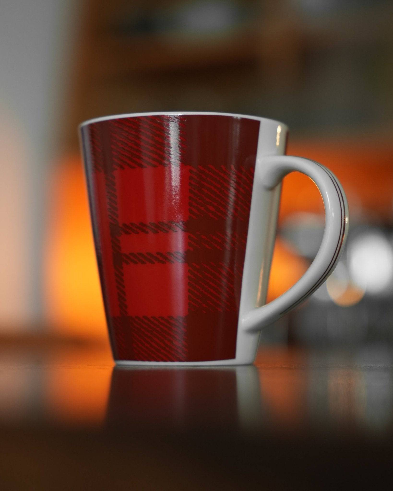Kalita ceramic mug with red plaid pattern, 300ml capacity, on dark surface with warm background lighting, showcasing stylish design for coffee enthusiasts