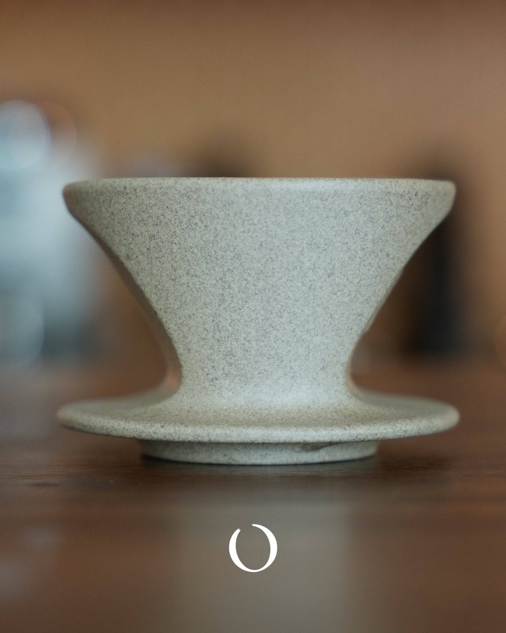 Kalita SG series sandstone clay Hasami-yaki coffee dripper, conical shape with textured matte finish, showcasing traditional Japanese craftsmanship for optimal coffee brewing