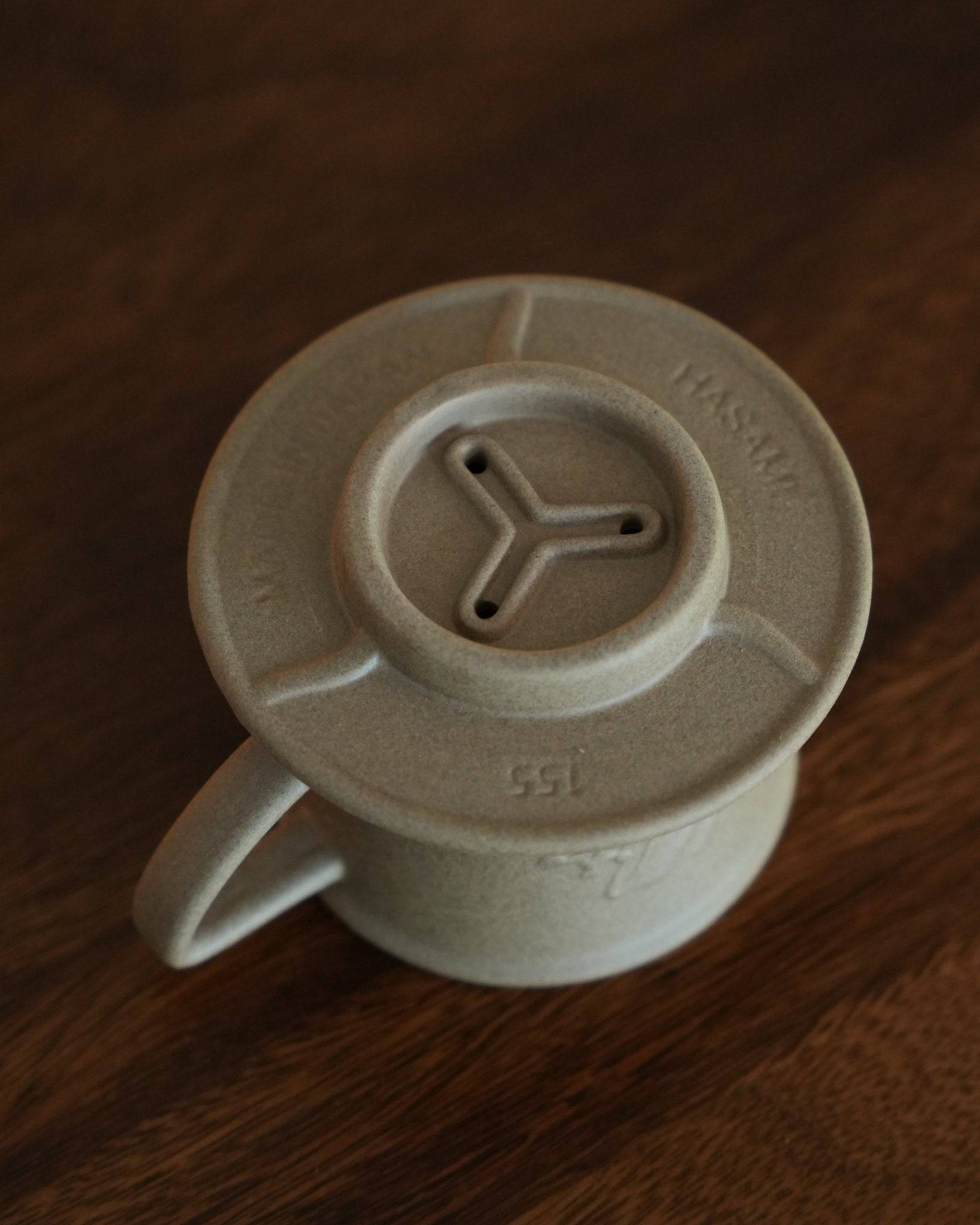 Kalita SG-155 Hasami-yaki sandstone coffee dripper with three-hole design, featuring unglazed rough ceramic surface for improved heat convection and extraction efficiency, ideal for 1-2 cups of coffee