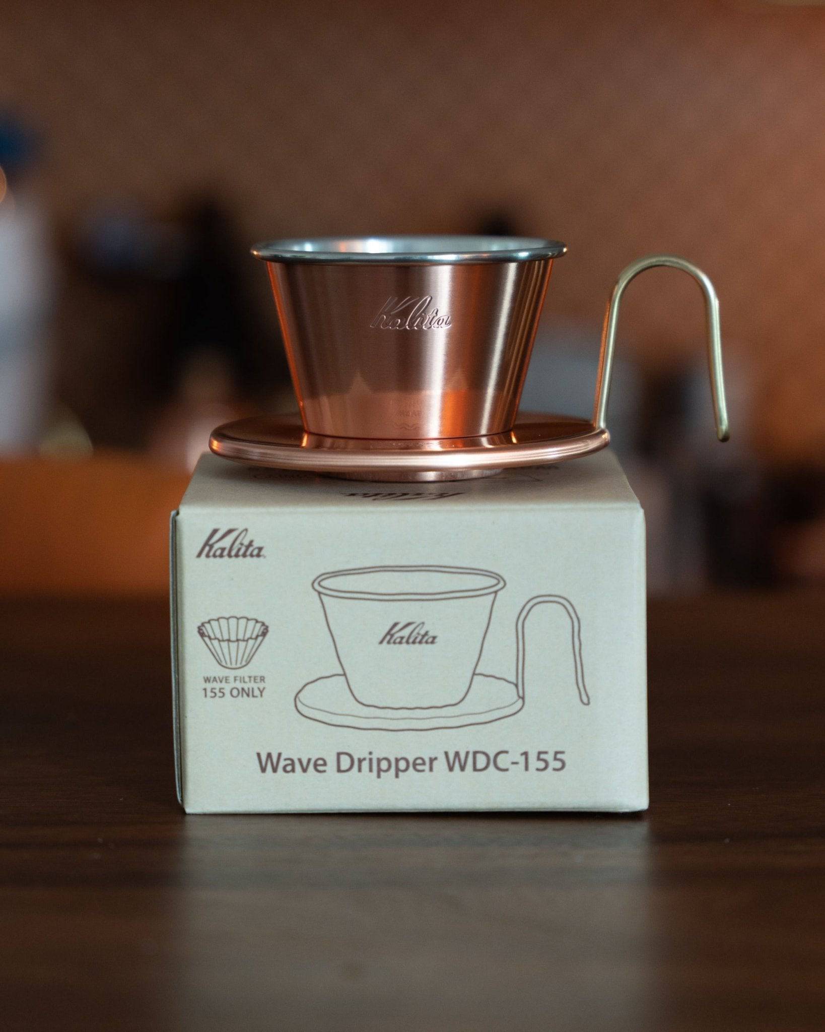 Kalita & TSUBAME WDC-155 copper pour-over coffee dripper with three-hole design, displayed on its product box featuring a schematic illustration, showcasing Japanese craftsmanship and premium coffee brewing equipment