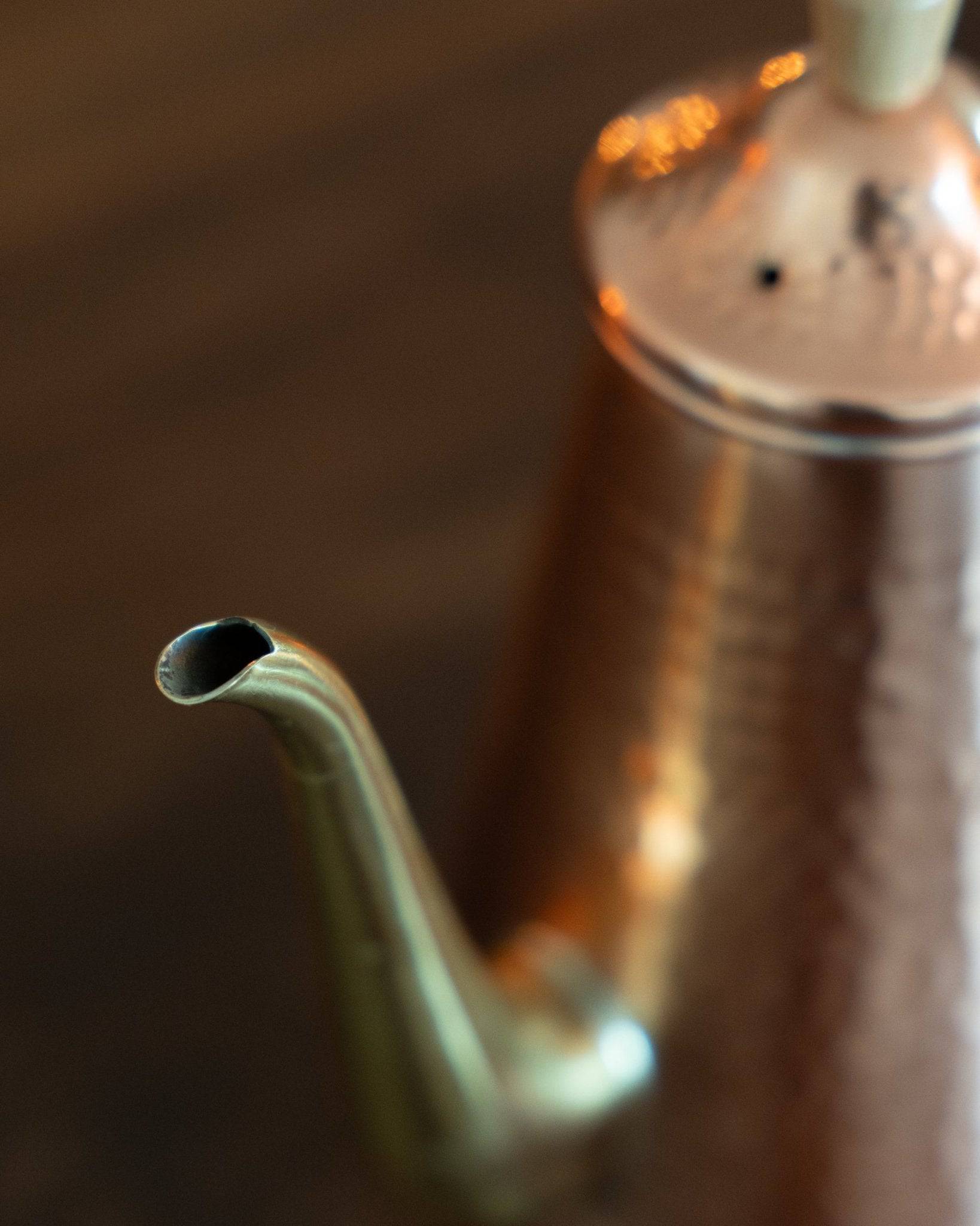 Kalita x Tsubame copper pour-over kettle with curved gooseneck spout, showcasing precision craftsmanship and elegant design for optimal coffee brewing control and heat retention