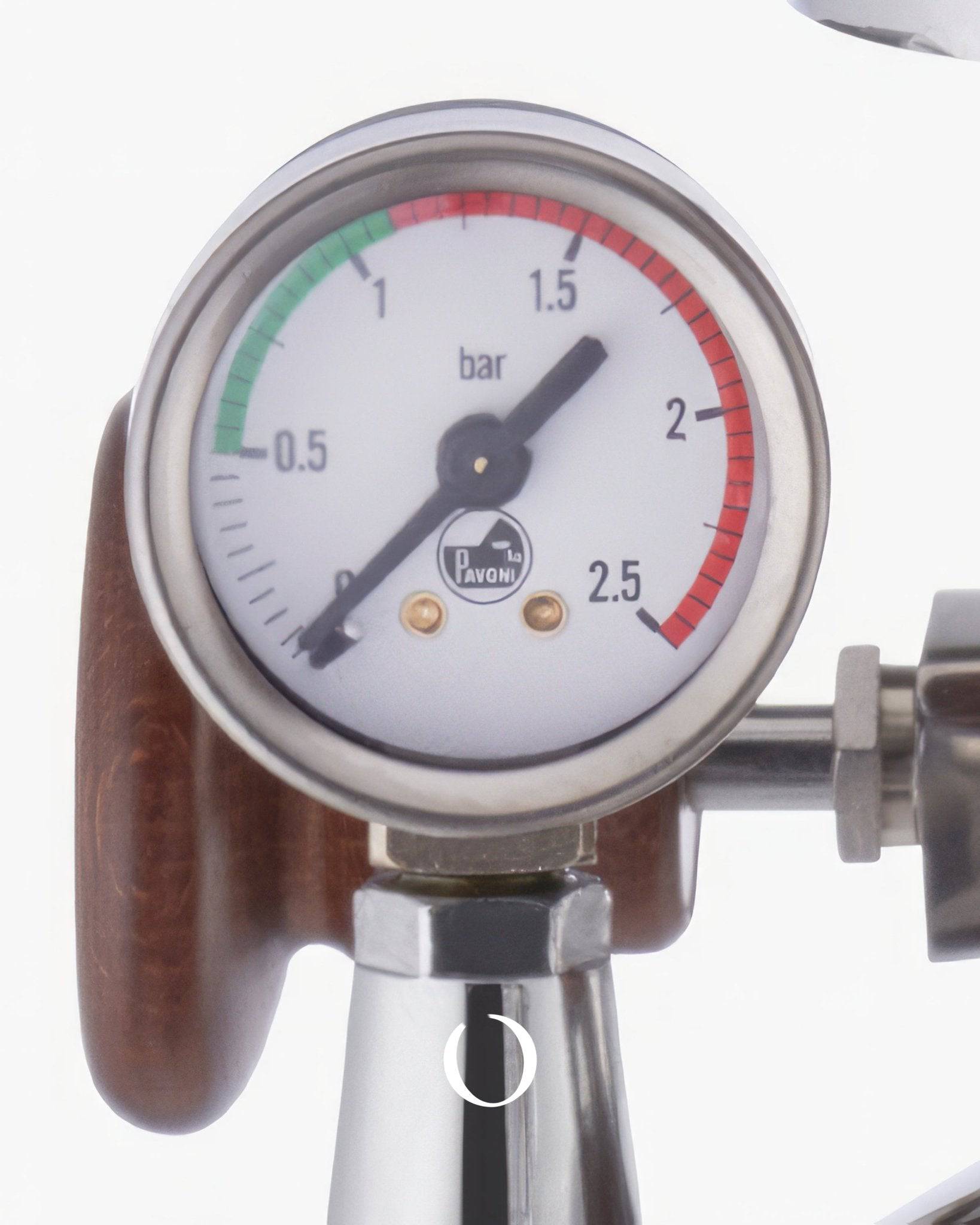 Closeup of La Pavoni espresso machine pressure gauge with wooden handle, showing bar measurement scale from 0 to 2.5, indicating precise brewing pressure control
