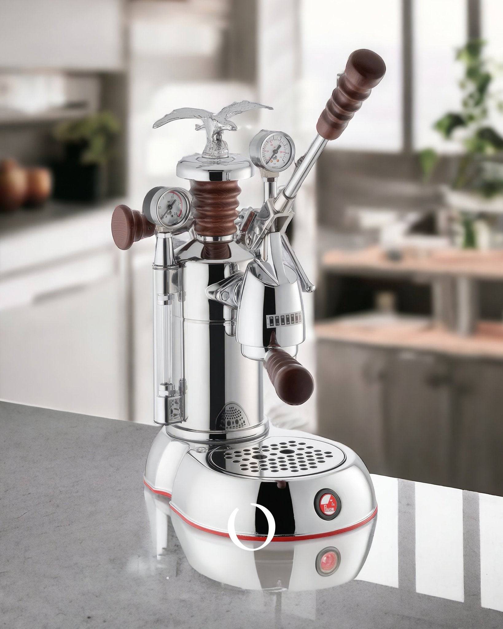 La Pavoni Esperto Abile espresso machine with chrome body, wooden handles, pressure gauges, and eagle-shaped steam knob on kitchen counter