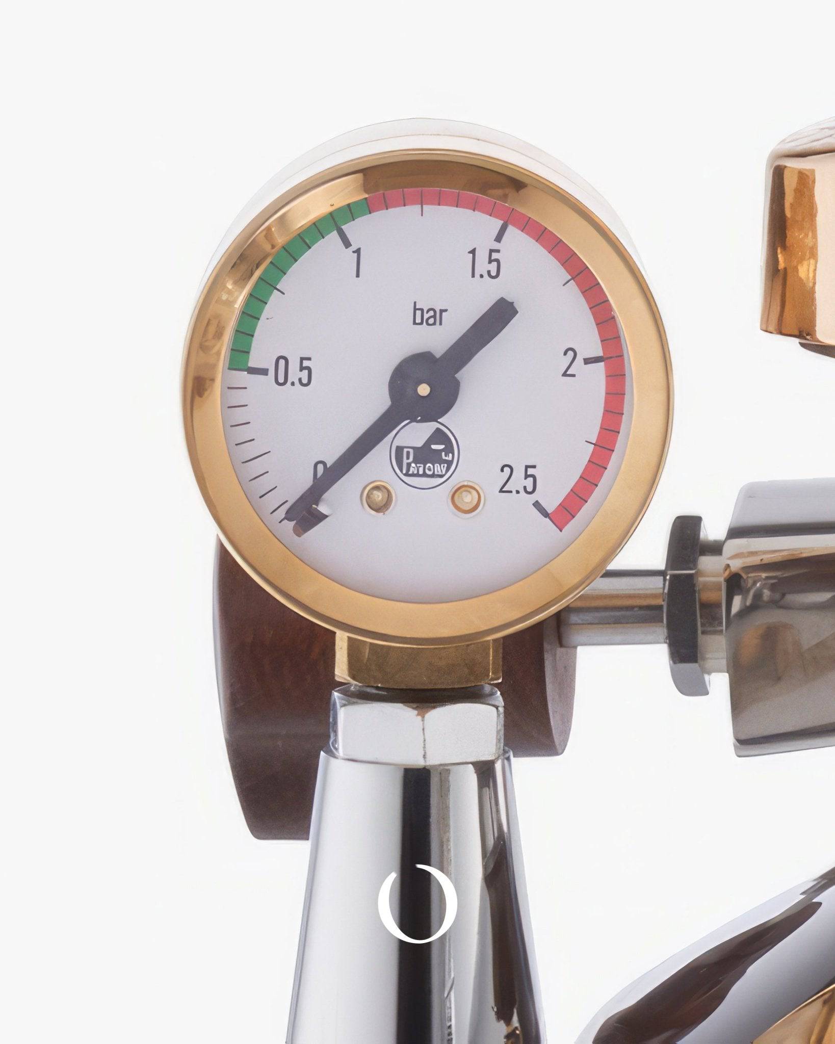 Close-up of La Pavoni EXPO Lever Espresso Machine pressure gauge showing 1.5 bar, with gold trim and La Pavoni logo, mounted on stainless steel body with wooden accents