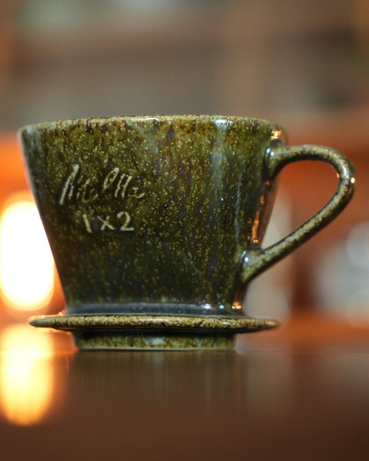 Melitta 1x2 ceramic pour-over coffee dripper in yellow-green glaze, showcasing traditional Minoyaki craftsmanship. Elegant fan-shaped design with single hole for optimal brewing. Limited edition color adds artistic value to home or office.