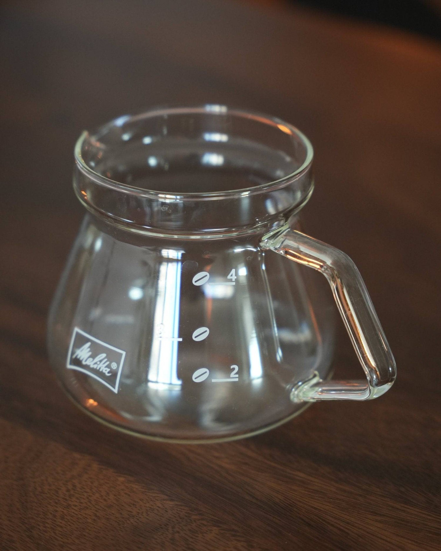 Melitta MJ500S glass coffee pot, 500ml capacity, transparent borosilicate glass, heat-resistant, microwave-safe, with comfortable handle and precise spout, featuring measurement markings and Melitta logo