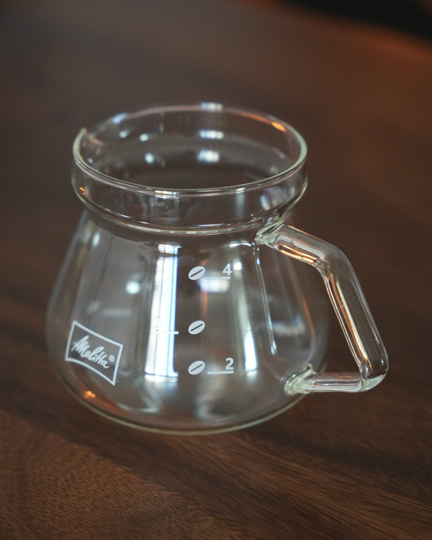 Melitta MJ500S glass coffee pot, 500ml capacity, transparent borosilicate glass, heat-resistant, microwave-safe, with comfortable handle and precise spout, featuring measurement markings and Melitta logo