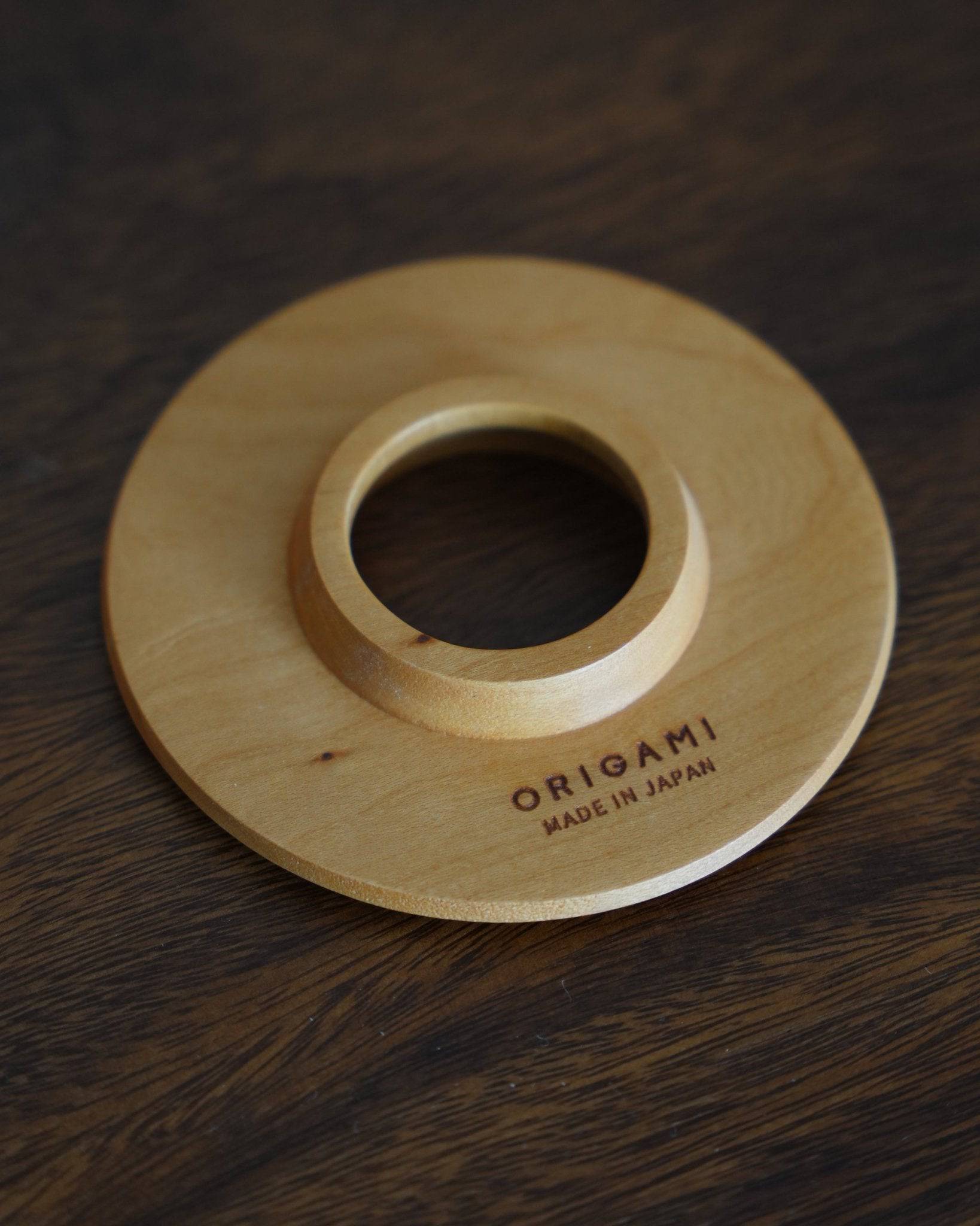Ninety Plus Coffee Kone Ring 10.1 in cherry wood color, a circular wooden base for mini brewing filters, made in Japan by Origami, showcasing elegant design and functionality for pour-over coffee enthusiasts