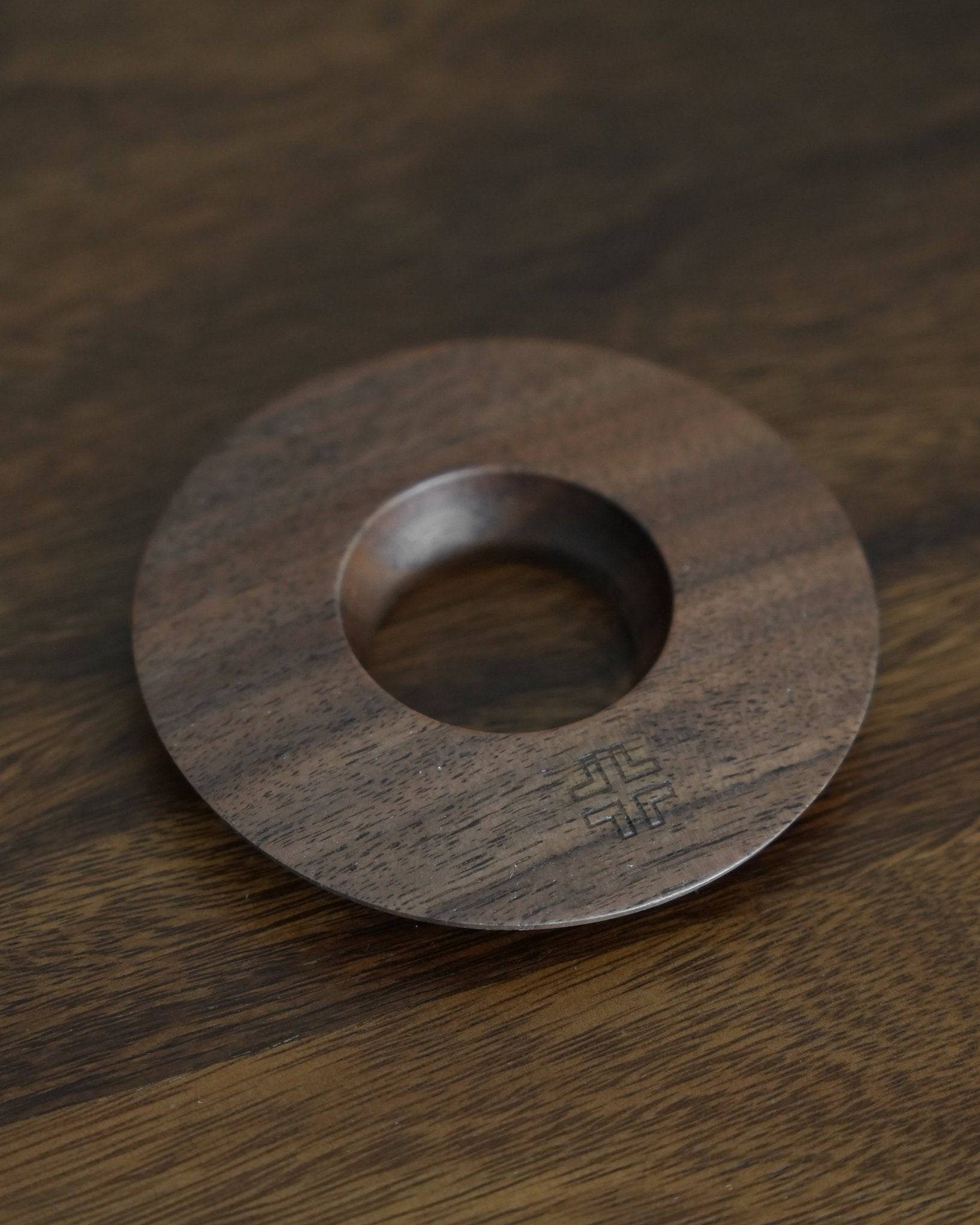 Ninety Plus Coffee Kone Ring 10.1 in walnut wood, circular base for mini pour-over coffee dripper, featuring sleek design with engraved logo, positioned on wooden surface