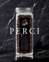 Glass jar filled with Ninety Plus Perci coffee beans, featuring a black label with white text and logo, set against a dark marble background. The word "PERCI" is prominently displayed in white text below the jar.