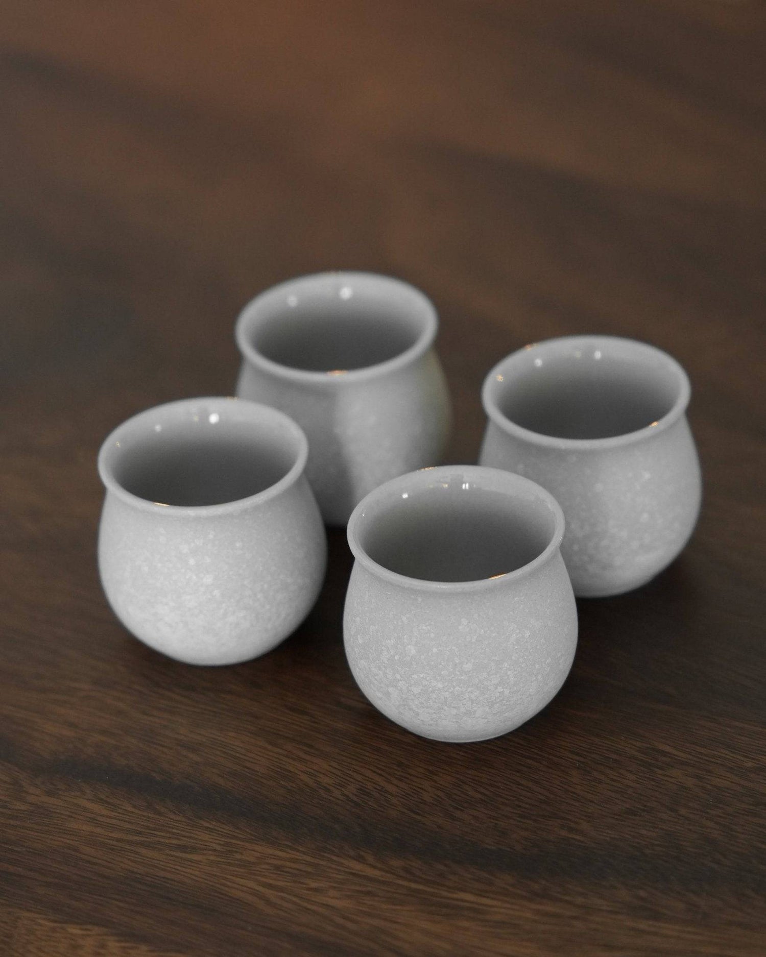 Four elegant white ceramic sharing cups from Ninety Plus Coffee&