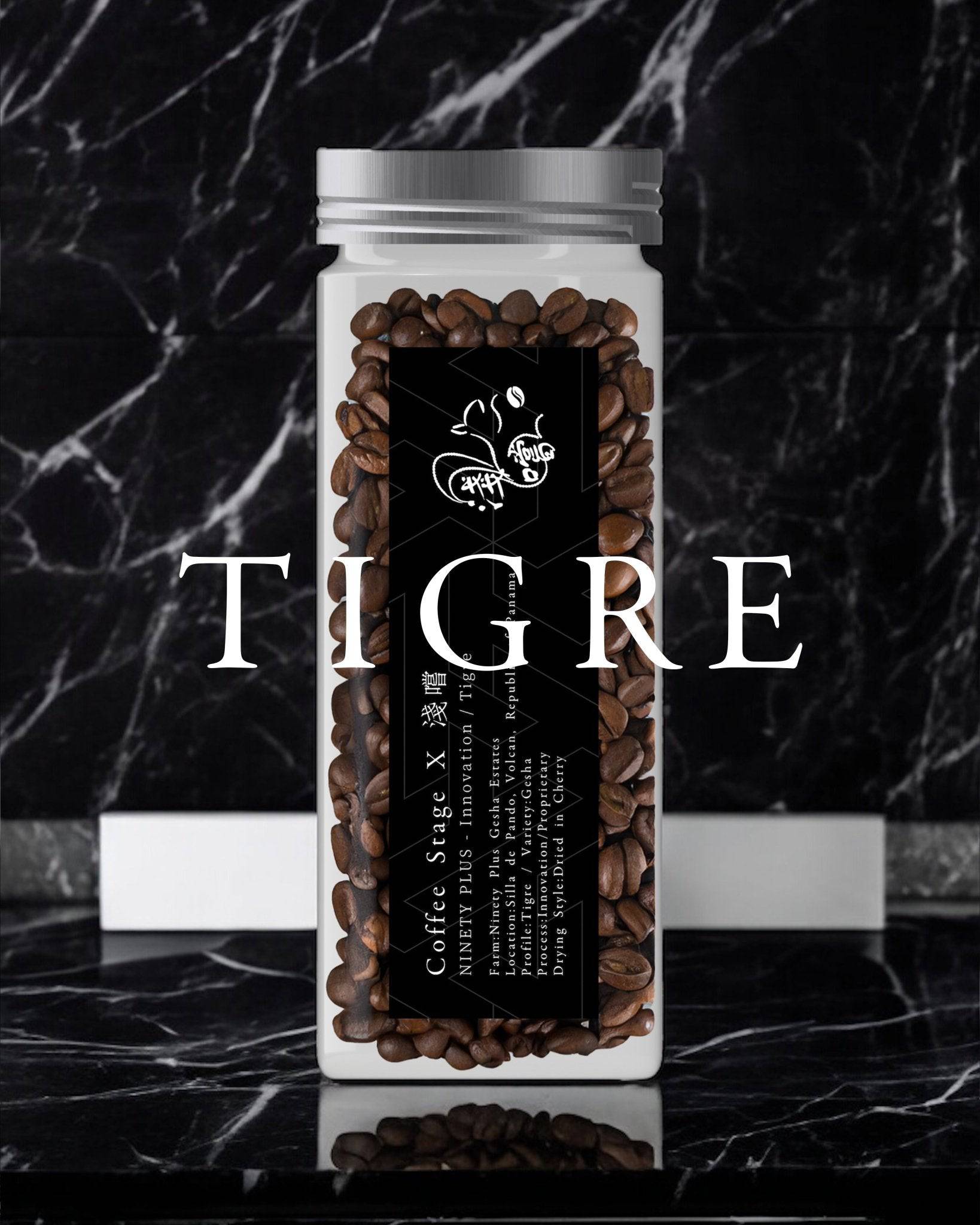 Glass jar filled with Tigre coffee beans from Ninety Plus, featuring a black label with white text and a butterfly logo, set against a marble background with the word "TIGRE" overlaid in large white letters.