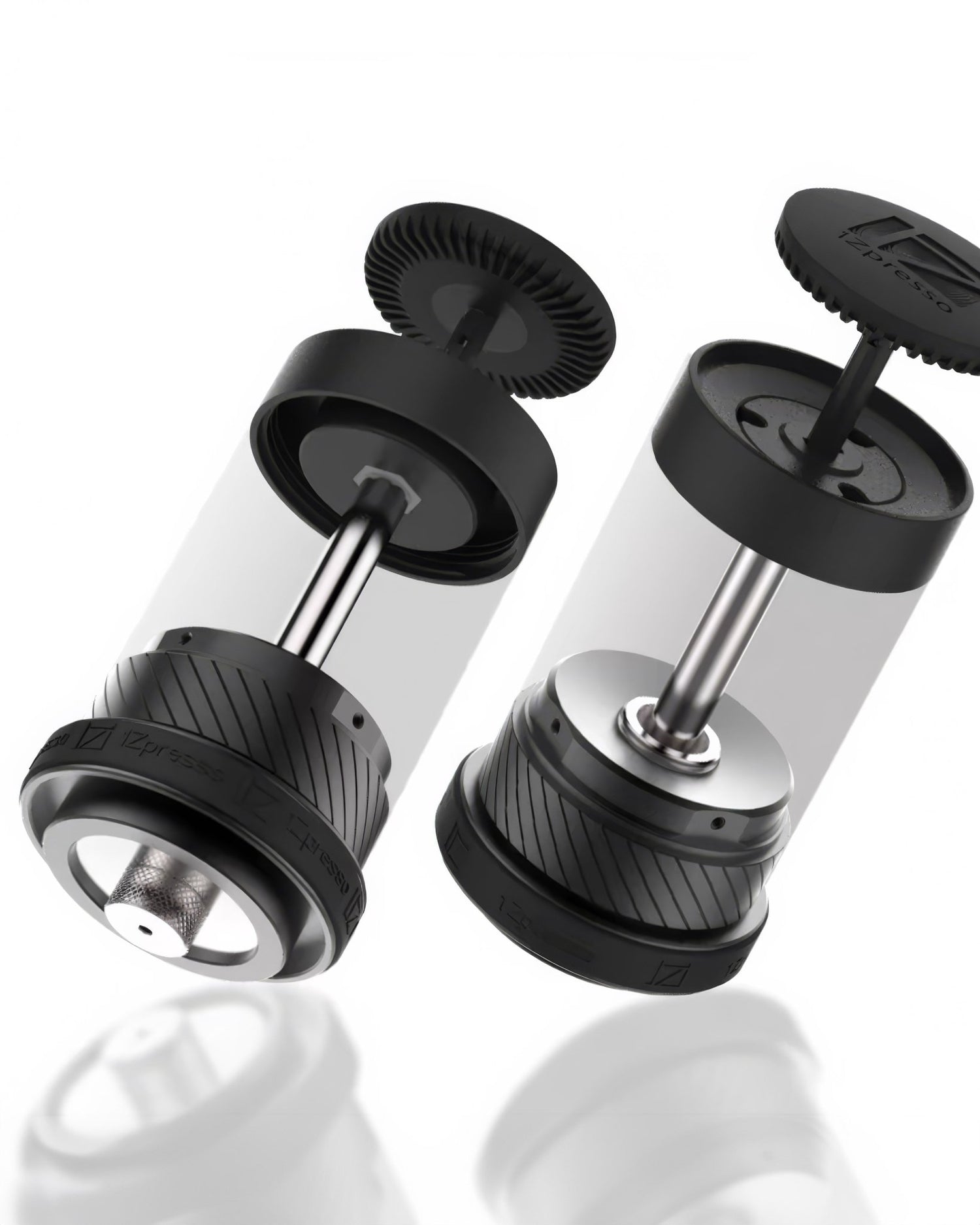 1Zpresso Y3 manual espresso maker components, showing disassembled parts with stainless steel pistons, black plastic bases, and transparent cylinders for coffee grounds and water