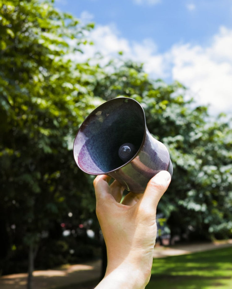 Coffee Stage Sharing Cup Beta Size held outdoors with the central aroma column visible inside