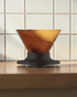 HARIO V60 NEO 01 amber pour-over coffee dripper on a Japanese-style coffee brewing counter, cover image candidate