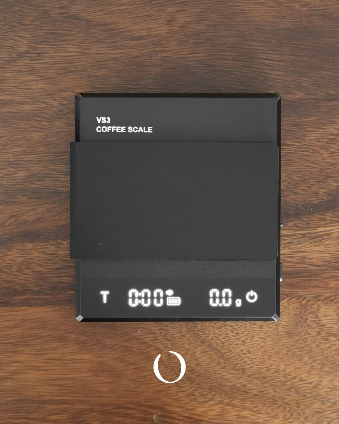 Ikape Espresso V83 Coffee Scale in black on wooden surface, displaying digital weight and timer, showcasing precision and functionality for coffee brewing