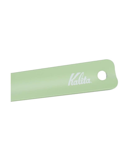 White Kalita logo and hanging-hole details on the handle of a Kalita Earth Series MORI forest-green coffee measuring scoop