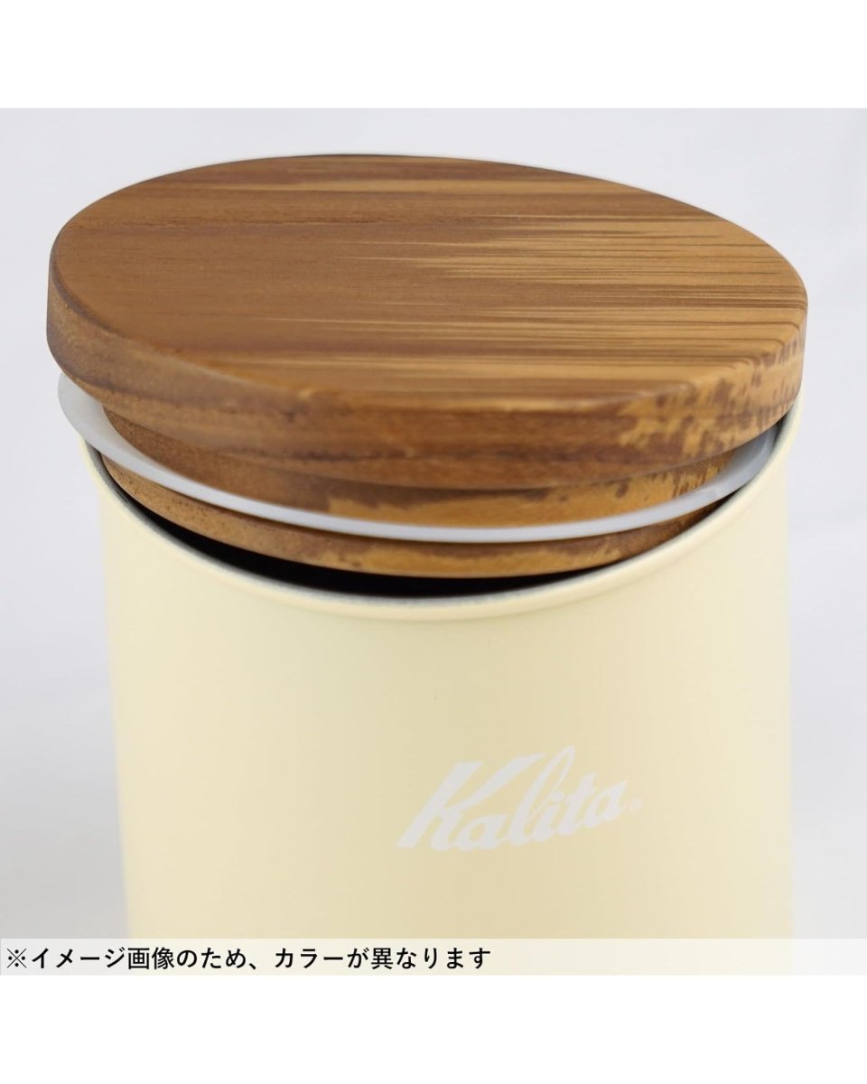 Natural wood lid and white silicone sealing-ring details on a Kalita Earth Series SUNA sand-coloured coffee bean canister