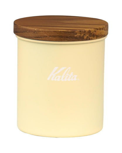 Front view of a Kalita Earth Series SUNA sand-coloured stainless steel coffee bean canister with a natural wood lid