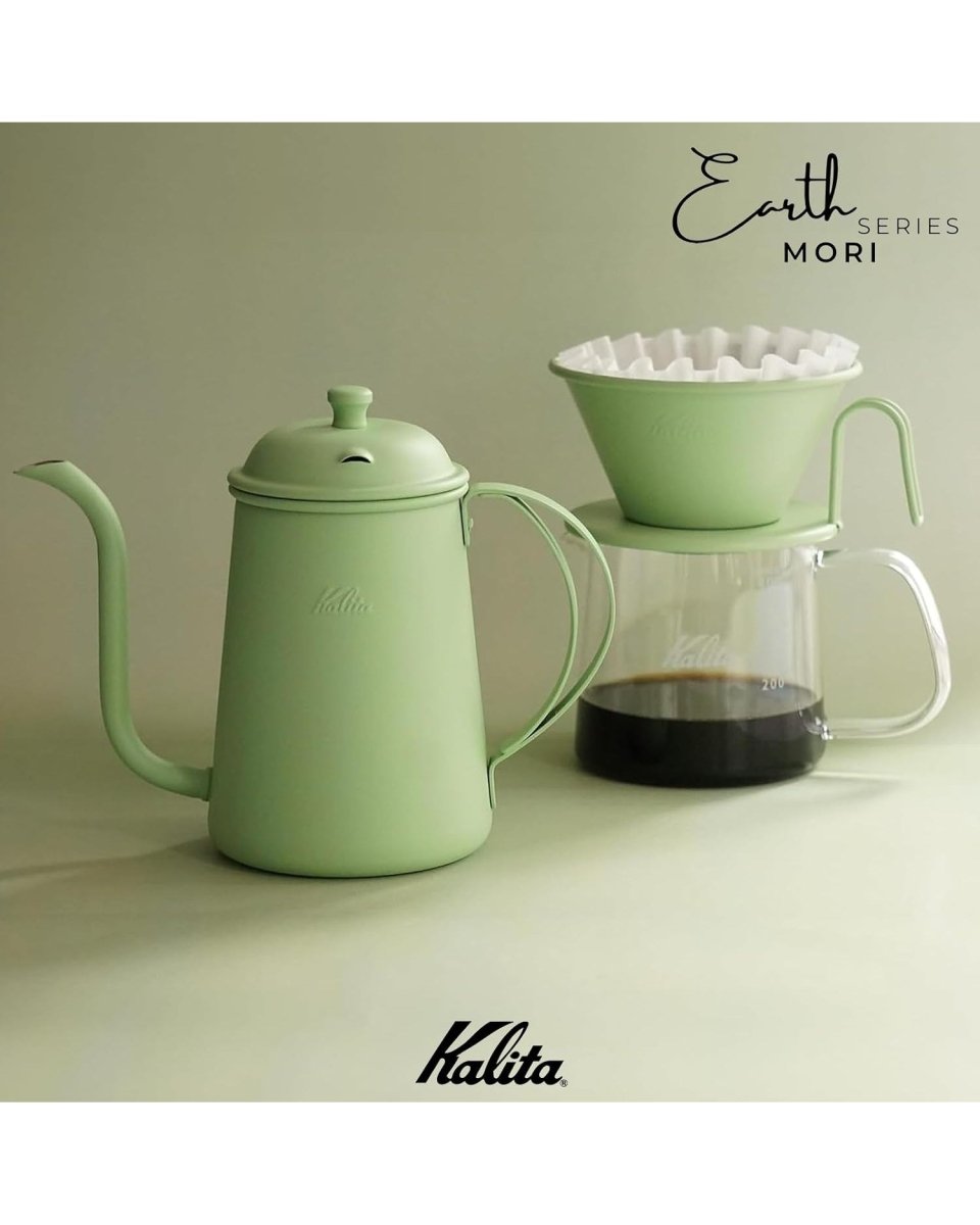 Colour-coordinated brewing set with a Kalita Earth Series MORI forest-green pour-over kettle and dripper plus a glass coffee server
