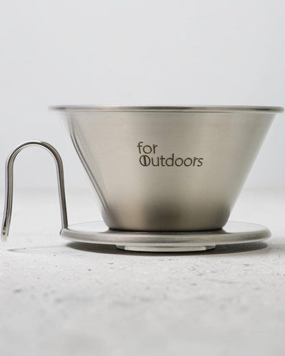 Kalita for Outdoors WDS-185K stainless steel Wave dripper on a light grey studio countertop