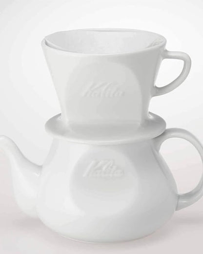 White Kalita ceramic dripper displayed on a white HASAMI &amp; Kalita HA coffee server