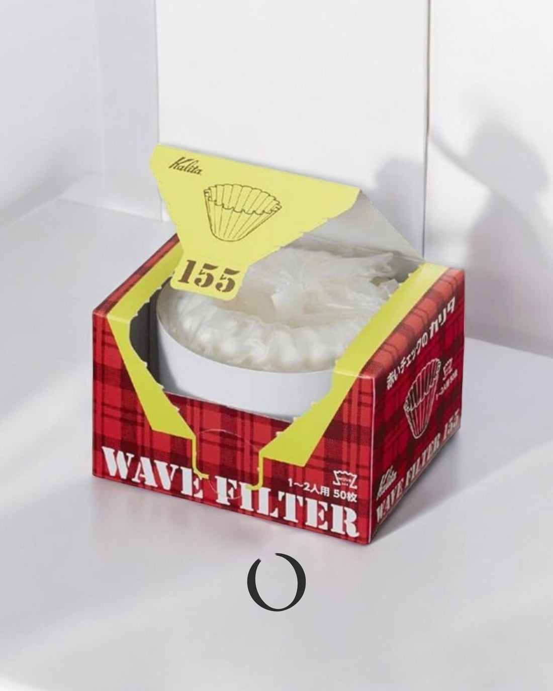 Kalita Wave 155 coffee filter papers in red and yellow box, showing white filters inside, on white surface