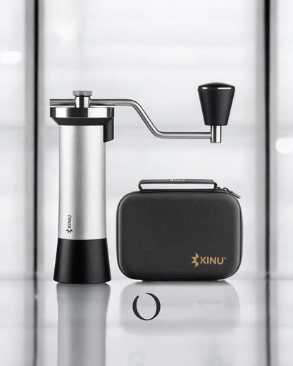 Kinu M47 Classic 2024 manual coffee grinder with stainless steel body, precision grinding mechanism, and travel case, showcasing premium German craftsmanship for optimal coffee grinding performance