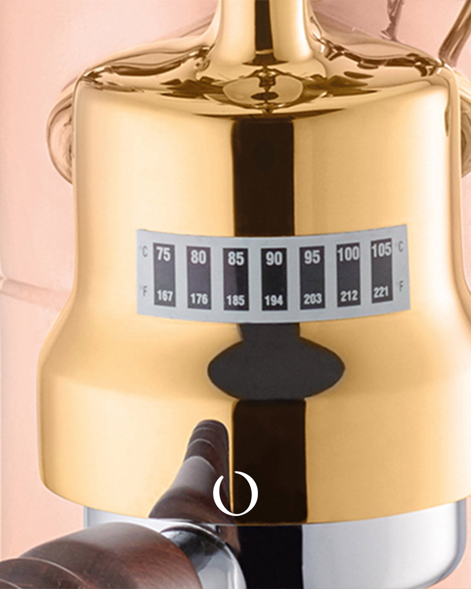 Close-up of La Pavoni Esperto Edotto espresso machine, showing its golden brass boiler with temperature gauge ranging from 75 to 105 degrees Celsius, highlighting the precision and quality of the manual lever machine.