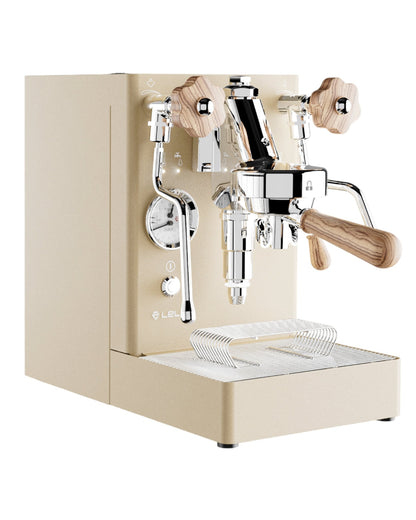 Lelit MaraX V2 gold special edition espresso machine with cream-colored body, chrome details, and wooden accents. Features dual boiler system, pressure gauges, and steam wand for professional-grade coffee brewing at home.