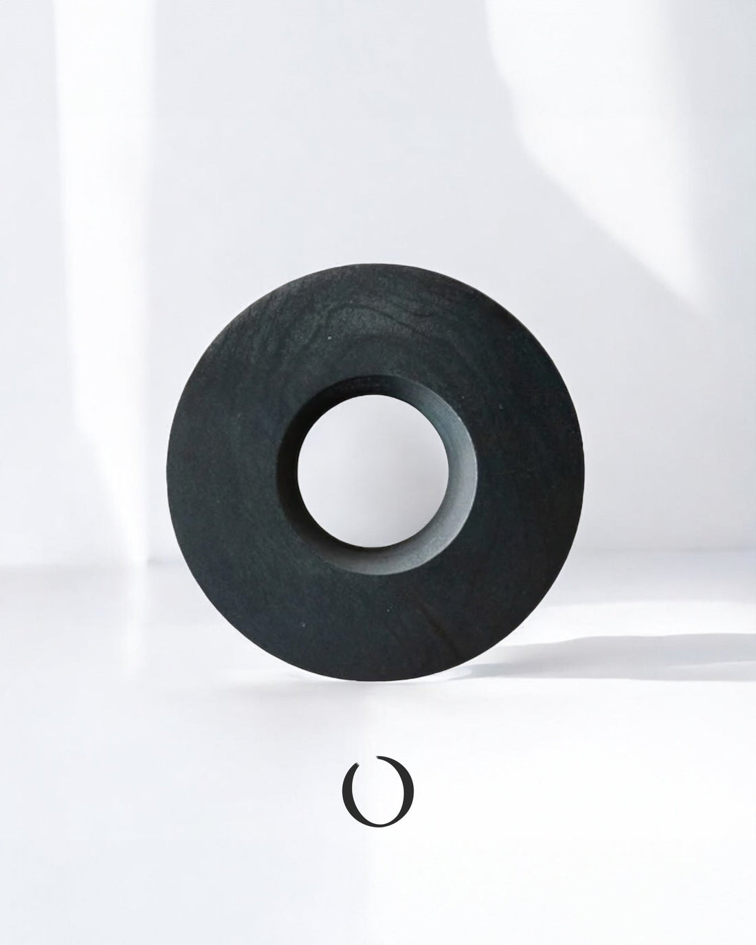 Handcrafted indigo-dyed wooden dripper holder by ORIGAMI x Watanabe, featuring a circular design with a central hole, showcasing unique wood grain and deep blue hues against a white background.