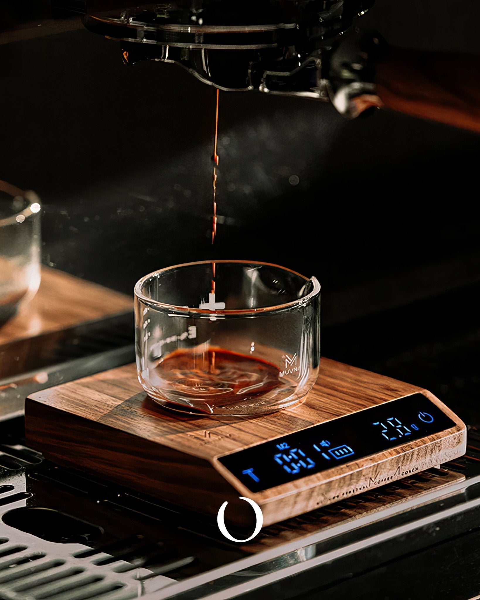 MUVNA walnut wood tilted electronic scale for coffee brewing, displaying weight and time on LCD screen, with espresso pouring into glass cup, showcasing precision and elegance in coffee preparation