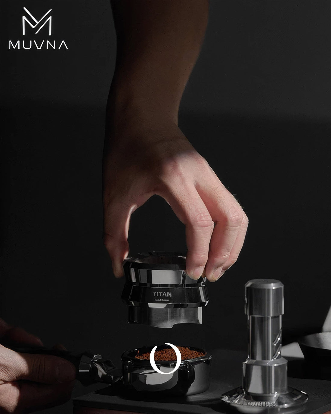 MUVNA Titan coffee distribution tool in use, evenly spreading grounds in portafilter for optimal espresso extraction, showcasing premium stainless steel design and precision