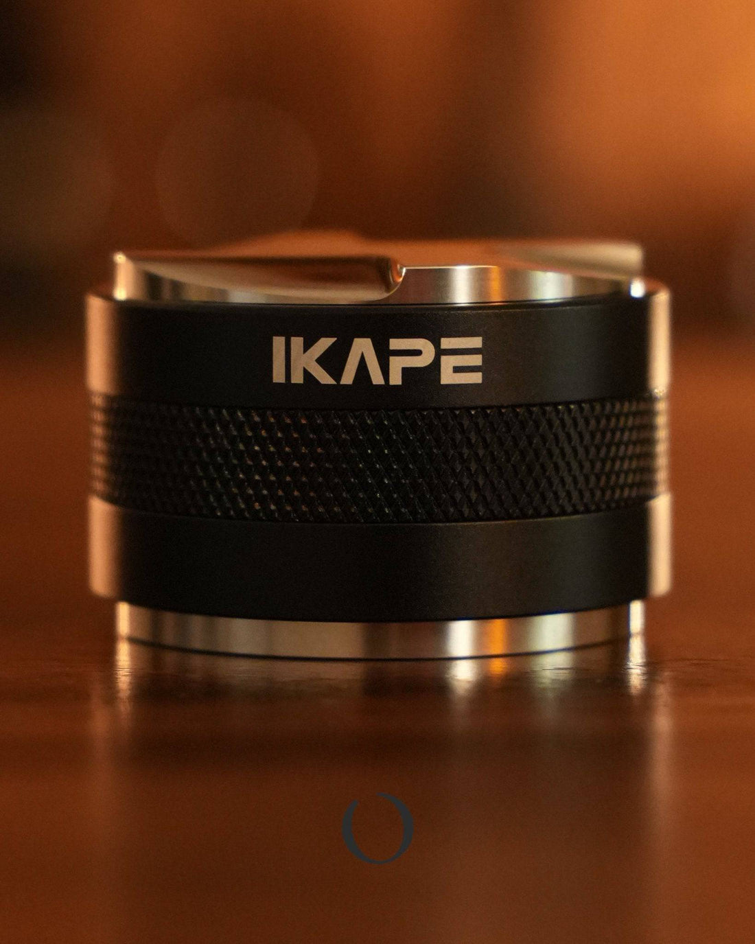 IKAPE 2-in-1 espresso distribution and tamping tool, black stainless steel design with textured grip, precision coffee brewing accessory for consistent extraction