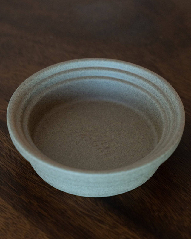 Kalita & HASAMI Hasami-yaki sandstone coffee dripper tray, circular design with raised center ring, matte texture, traditional Japanese craftsmanship, perfect for Kalita wave drippers, enhances coffee brewing experience